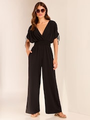 Lipsy Black V Neck Wrap Holiday Shop Jumpsuit - Image 1 of 4