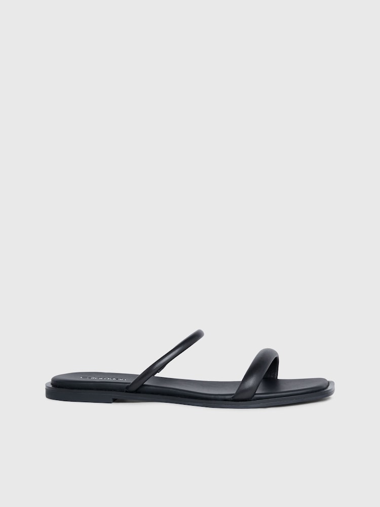 Calvin Klein Black Flat Leather Slides - Image 1 of 5 Calvin Klein Black Flat Leather Slides - Image 1 of 5