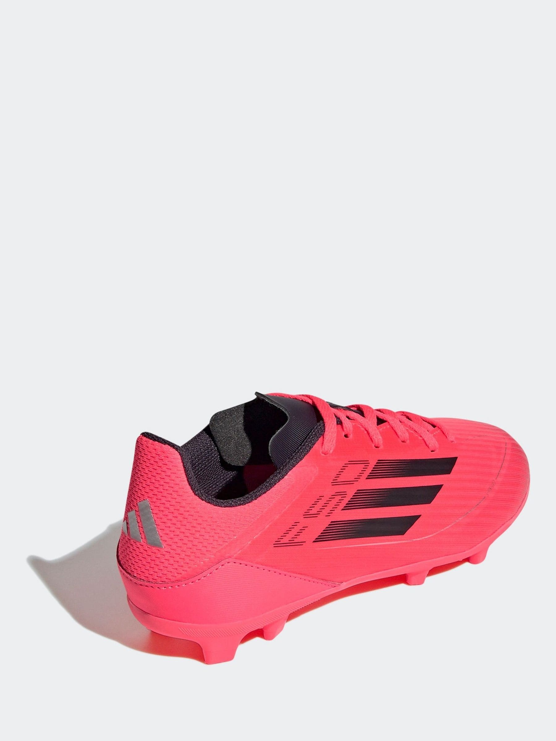 bright neon soccer cleats