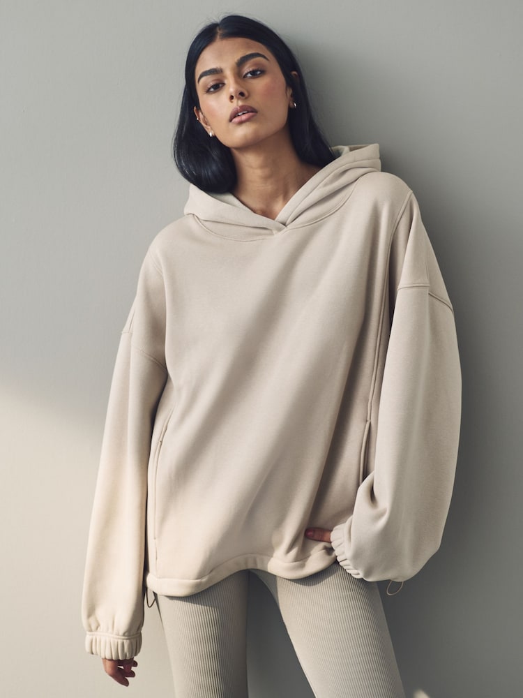 Haferflocken - Kuscheliger, mit Fleece gefütterter Longline-Hoodie mit schwerer Materialqualität - Bild 1 von 11