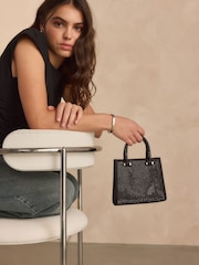 أسود - حقيبة يد براقة - صورة 1 من 1