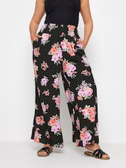 Yours Curve Black Floral Bloom Print Shirred Wide Leg Trousers - Image 1 of 5
