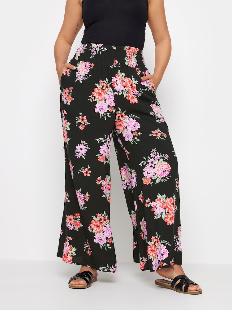 Yours Curve Black Floral Bloom Print Shirred Wide Leg Trousers - Image 1 of 5