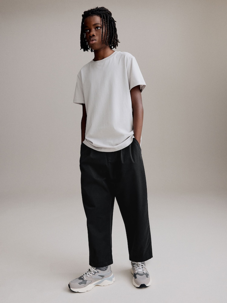 Schwarz - Schmal zulaufende, elegante Smart-Hosen (3—16Jahre) - Bild 2 von 11 Schwarz - Schmal zulaufende, elegante Smart-Hosen (3—16Jahre) - Bild 2 von 11