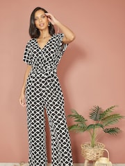 Yumi Black Geometric Print Wrap Jumpsuit - Image 1 of 5