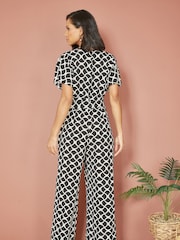 Yumi Black Geometric Print Wrap Jumpsuit - Image 2 of 5
