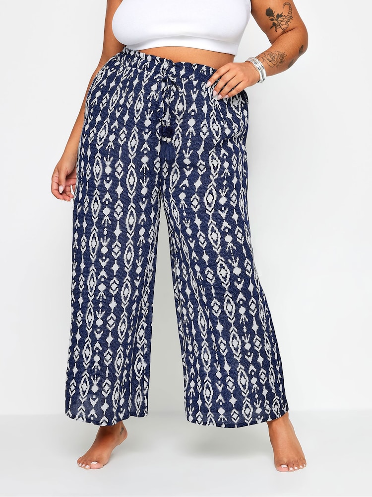 Yours Curve Blue Navy Ikat Print Crinkle Tassel Trousers - Image 1 of 5
