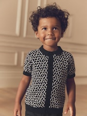 Black Geo Button Through Knitted Short Sleeve 100% Cotton Polo Shirt (3mths-7yrs) - Image 1 of 7