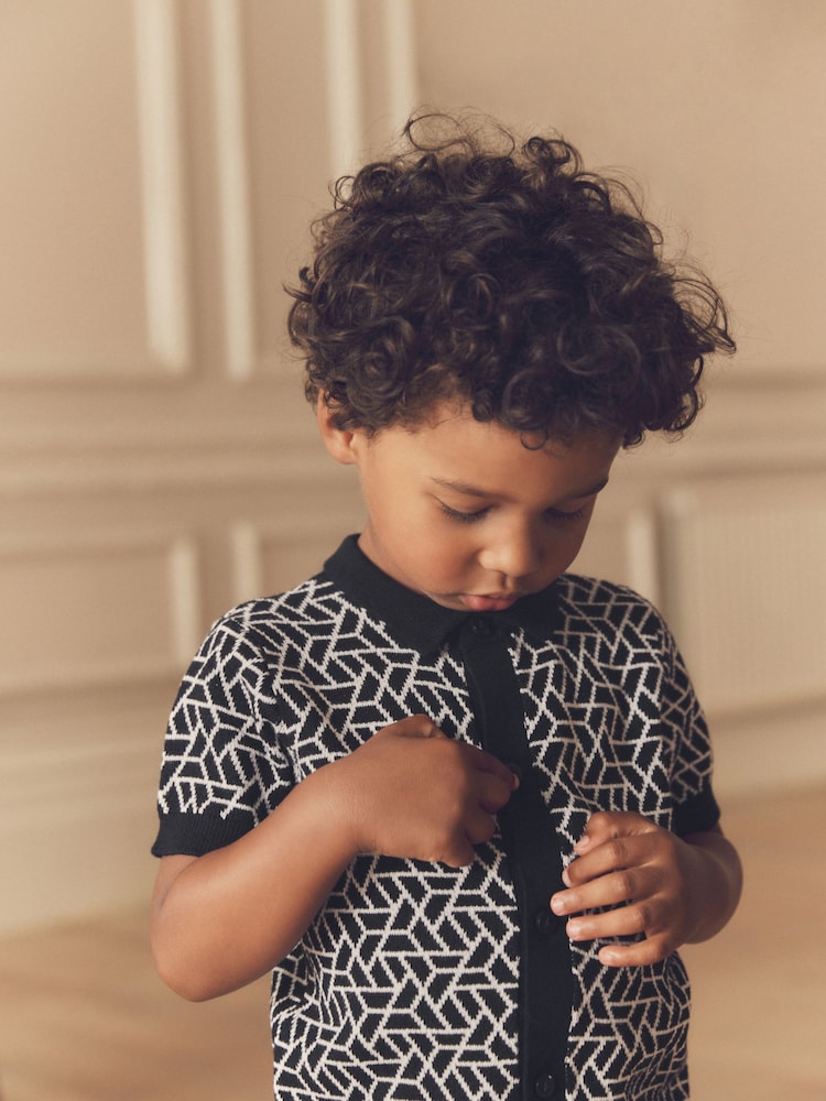 Black Geo Button Through Knitted Short Sleeve 100% Cotton Polo Shirt (3mths-7yrs) - Image 2 of 7 Black Geo Button Through Knitted Short Sleeve 100% Cotton Polo Shirt (3mths-7yrs) - Image 2 of 7