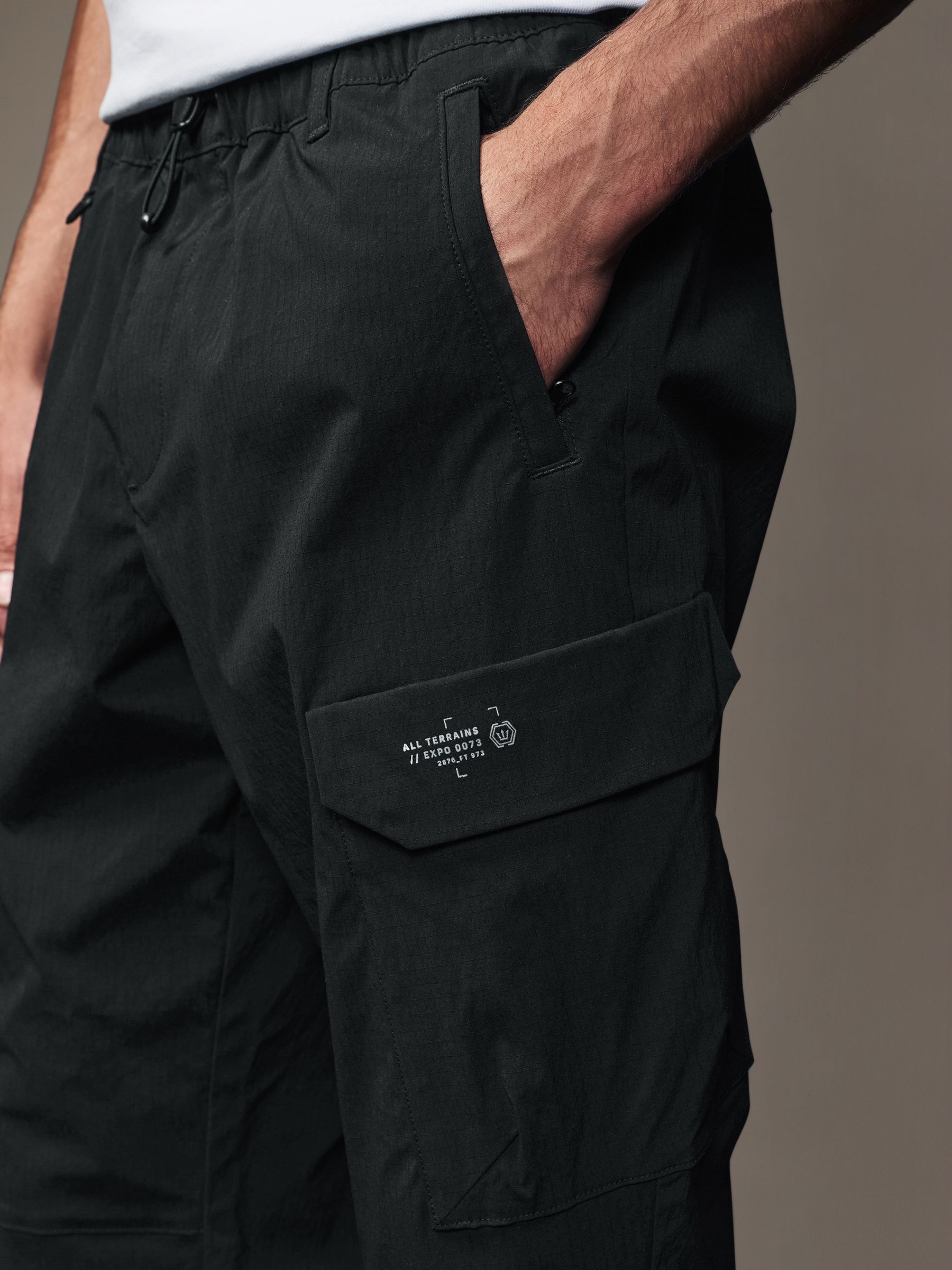Buy Black Regular Fit Ripstop Tech Cargo Trousers from Next USA
