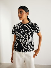 Schwarz/Weiß Abstrakter Print - Kurzärmeliges T-Shirt mit Rundhalsausschnitt aus 100 % Baumwolle - Bild 1 von 7