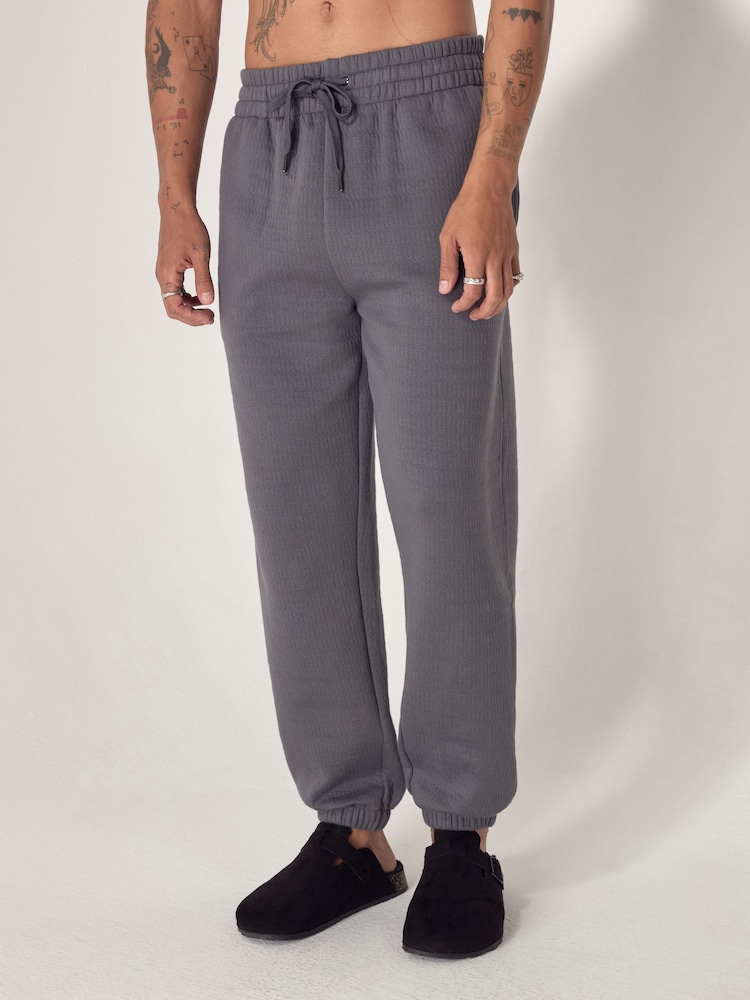 رمادي - EDIT Heavyweight Textured Joggers - صورة 1 من 9 رمادي - EDIT Heavyweight Textured Joggers - صورة 1 من 9