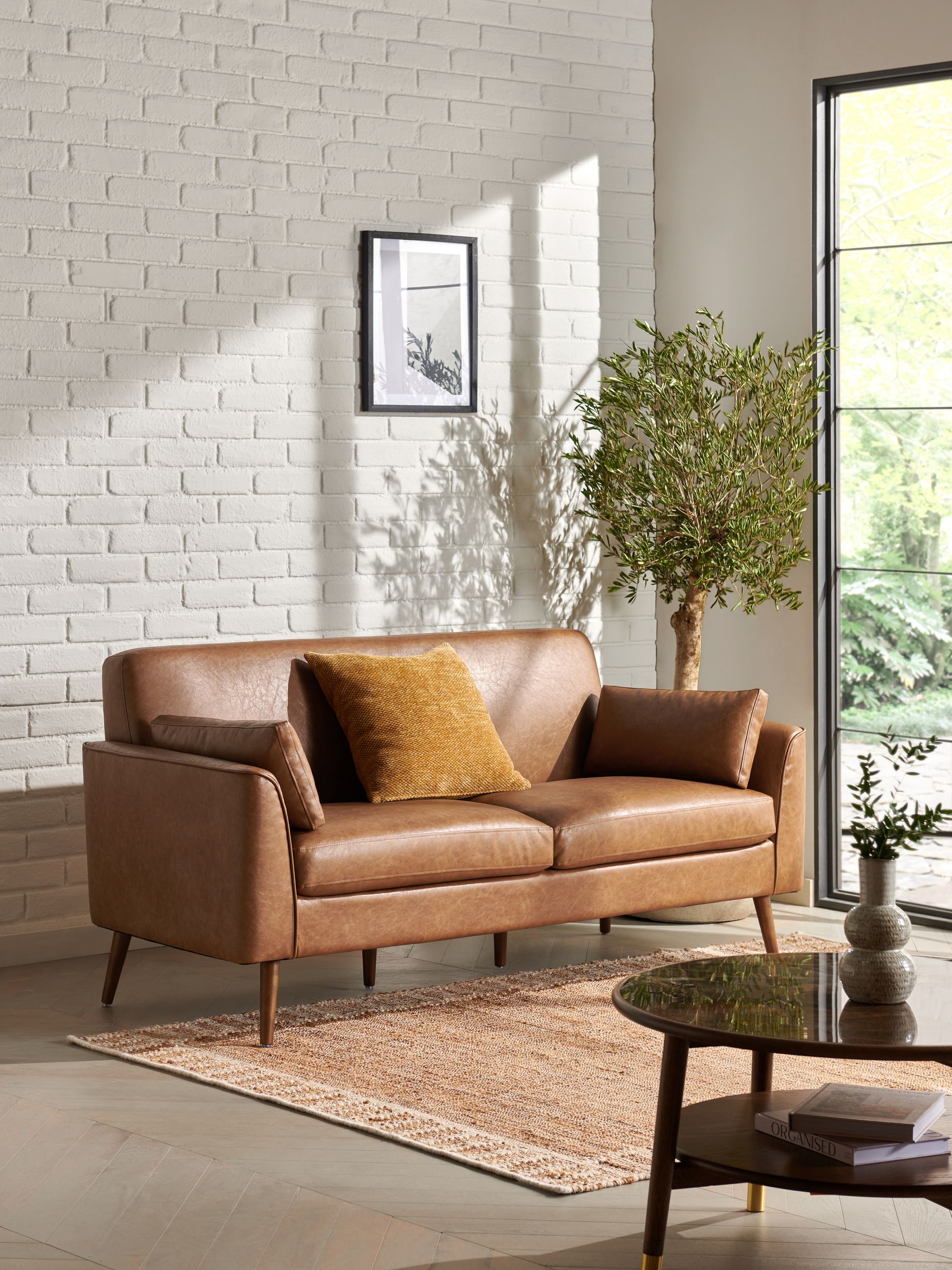 Small brown leather sofa 2025