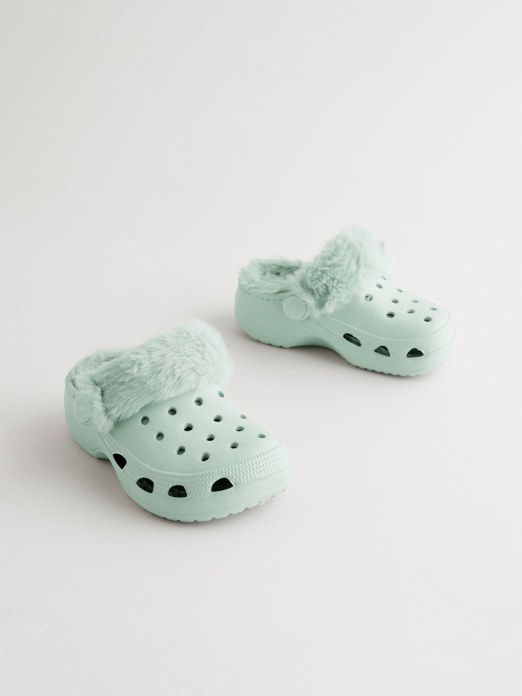Buy Sage Green Faux Fur Lined Clog Slippers from the Next UK online shop