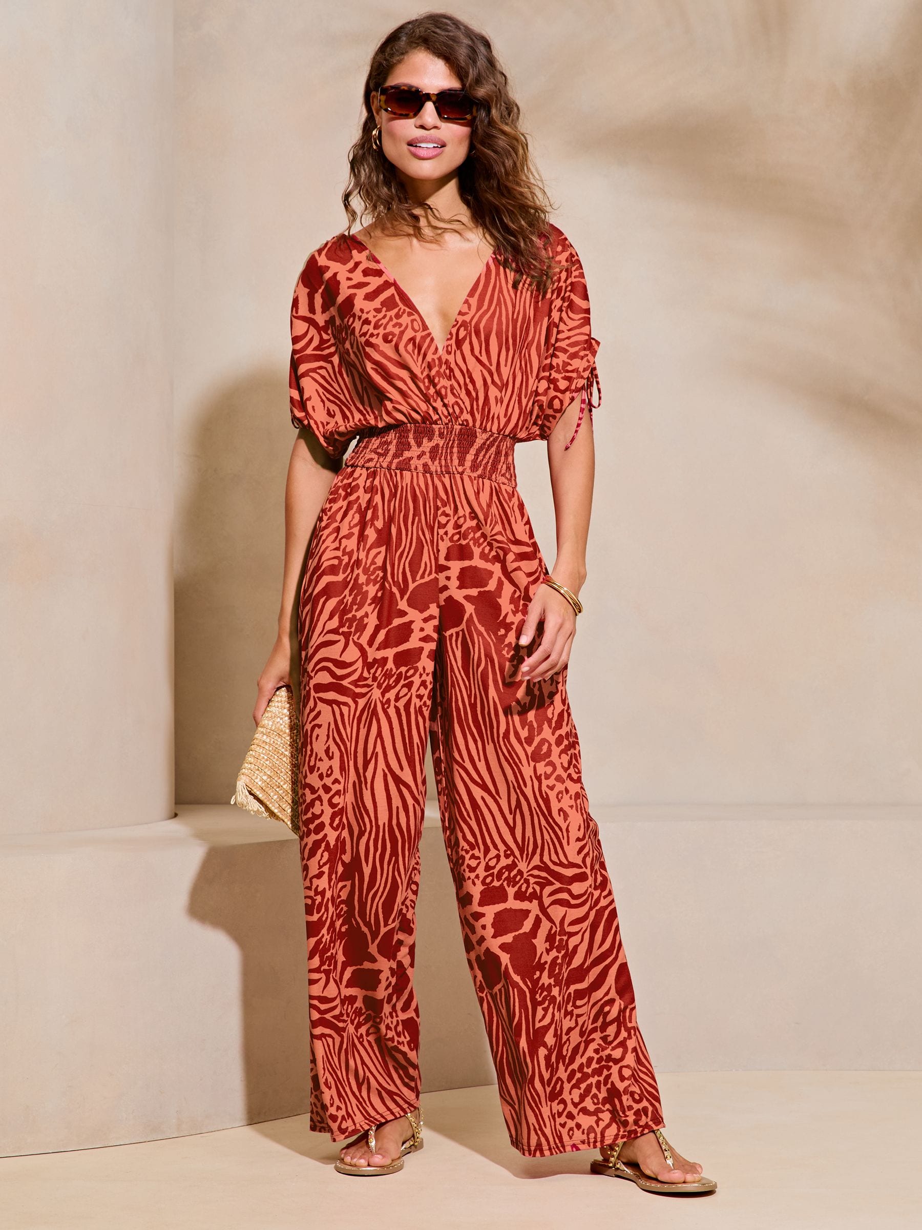 Buy Lipsy Red Animal Print V Neck Wrap Holiday Shop Jumpsuit from Next Luxembourg