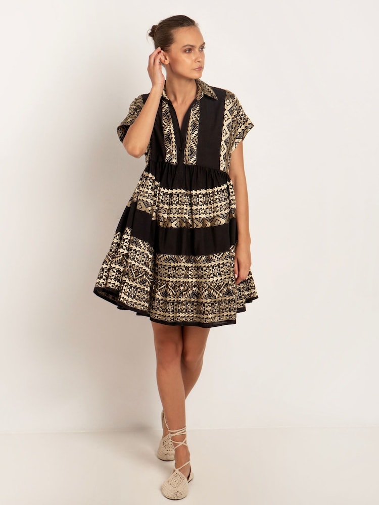 Greek Archaic Kori Embroidered 100% Cotton Tiered Black Mini Dress - Image 1 of 3 Greek Archaic Kori Embroidered 100% Cotton Tiered Black Mini Dress - Image 1 of 3