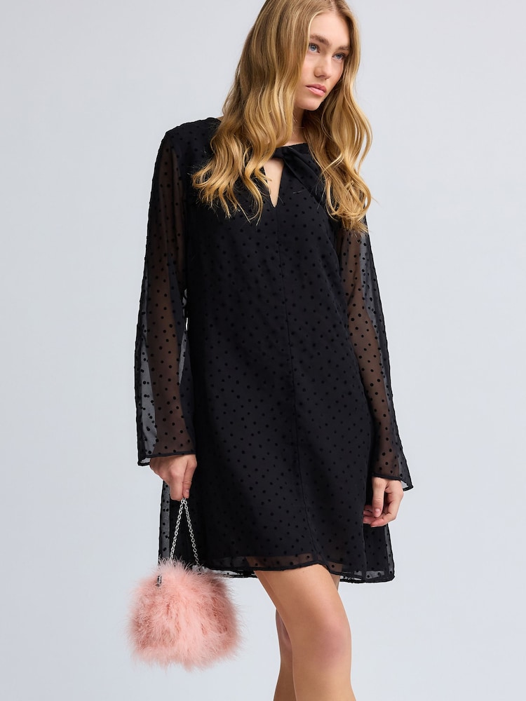 Black On Black Polka Dot Spot Bow Neck Detail Long Sleeve Mini Dress - Image 1 of 7 Black On Black Polka Dot Spot Bow Neck Detail Long Sleeve Mini Dress - Image 1 of 7