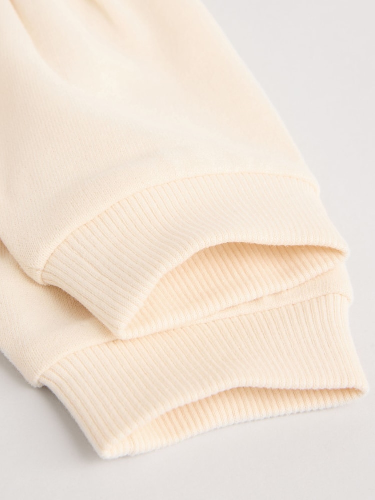 Crema/lila con gráfico de personaje - Conjunto de pantalones de chándal y top de manga larga para bebé - Imagen 14 de 14 Crema/lila con gráfico de personaje - Conjunto de pantalones de chándal y top de manga larga para bebé - Imagen 14 de 14