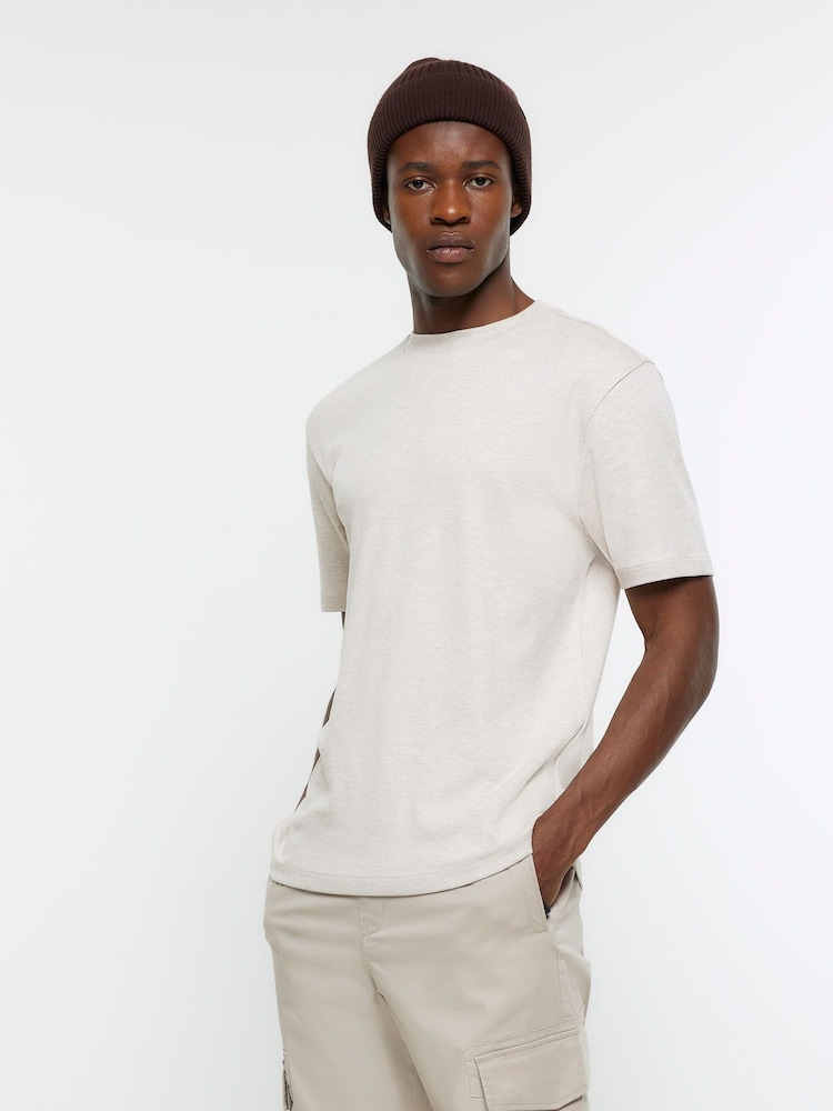 River Island Cream 100% Cotton Studio Short Sleeve Slim Fit T-Shirt - Image 1 of 4 River Island Cream 100% Cotton Studio Short Sleeve Slim Fit T-Shirt - Image 1 of 4