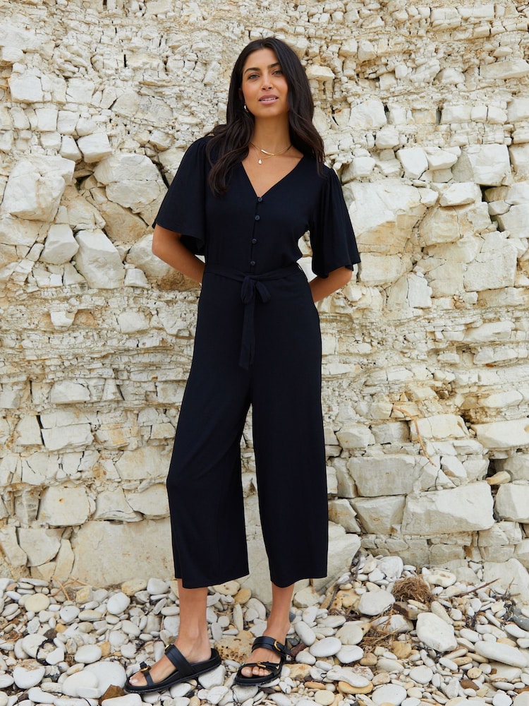 Threadbare Black Jersey Flutter Sleeve Belted Jumpsuit - Image 1 of 4 Threadbare Black Jersey Flutter Sleeve Belted Jumpsuit - Image 1 of 4