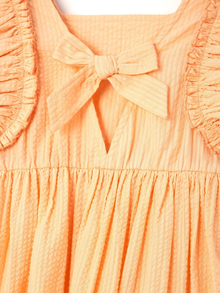 Angel & Rocket Orange 100% Cotton Simone Textured Ruffle Dress - Image 6 of 6 Angel & Rocket Orange 100% Cotton Simone Textured Ruffle Dress - Image 6 of 6