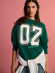 Forest Green Official Wicked Movie License Oz Varsity Green Crewneck Sweatshirt - Image 1 of 7