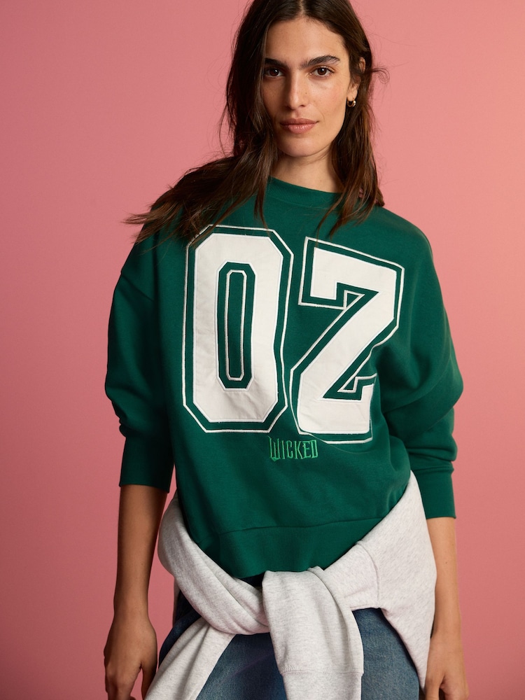 Forest Green Official Wicked Movie License Oz Varsity Green Crewneck Sweatshirt - Image 1 of 7