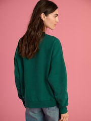Forest Green Official Wicked Movie License Oz Varsity Green Crewneck Sweatshirt - Image 3 of 7