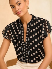 Love & Roses Black Polka Dot V Neck Flutter Sleeve Blouse - Image 1 of 4