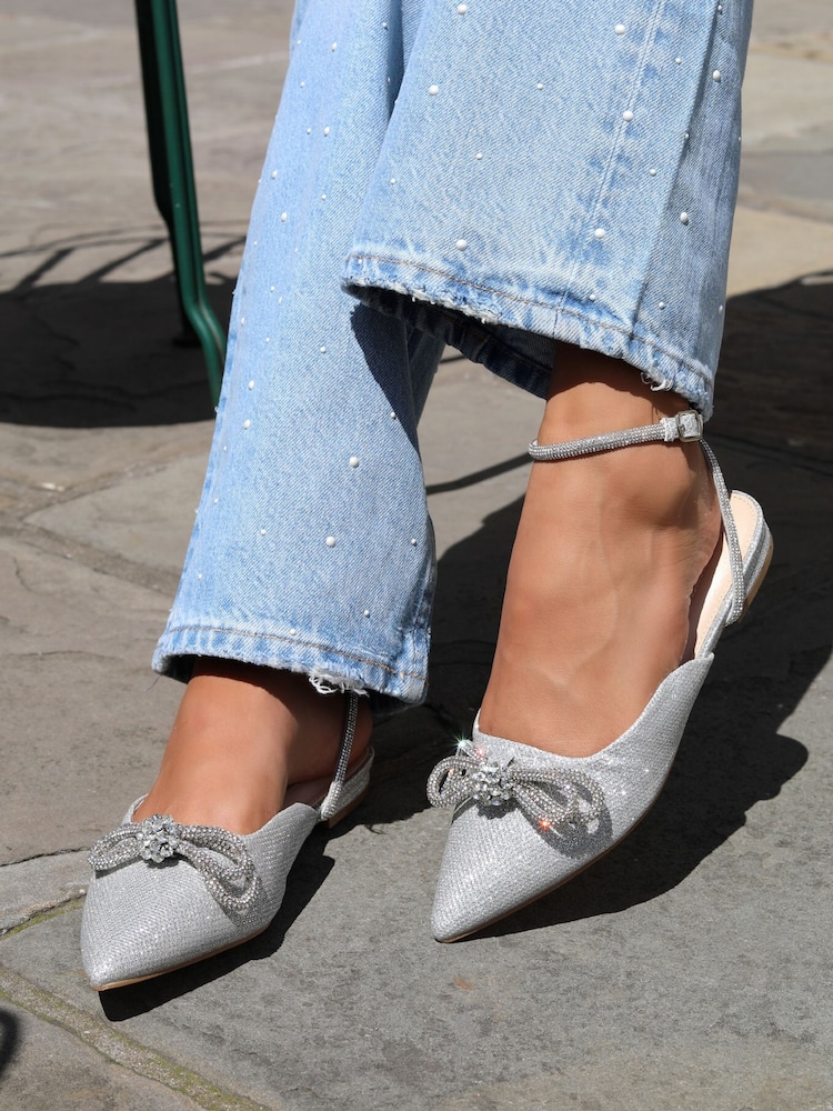 Linzi Silver Mayla Satin Flat Mules With Diamante Bow Detail - Image 1 of 4 Linzi Silver Mayla Satin Flat Mules With Diamante Bow Detail - Image 1 of 4