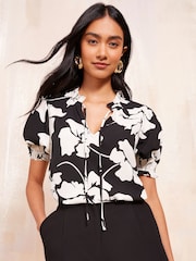 Friends Like These Black/White Short Sleeve Woven Tie Neck Blouse - Image 1 of 4