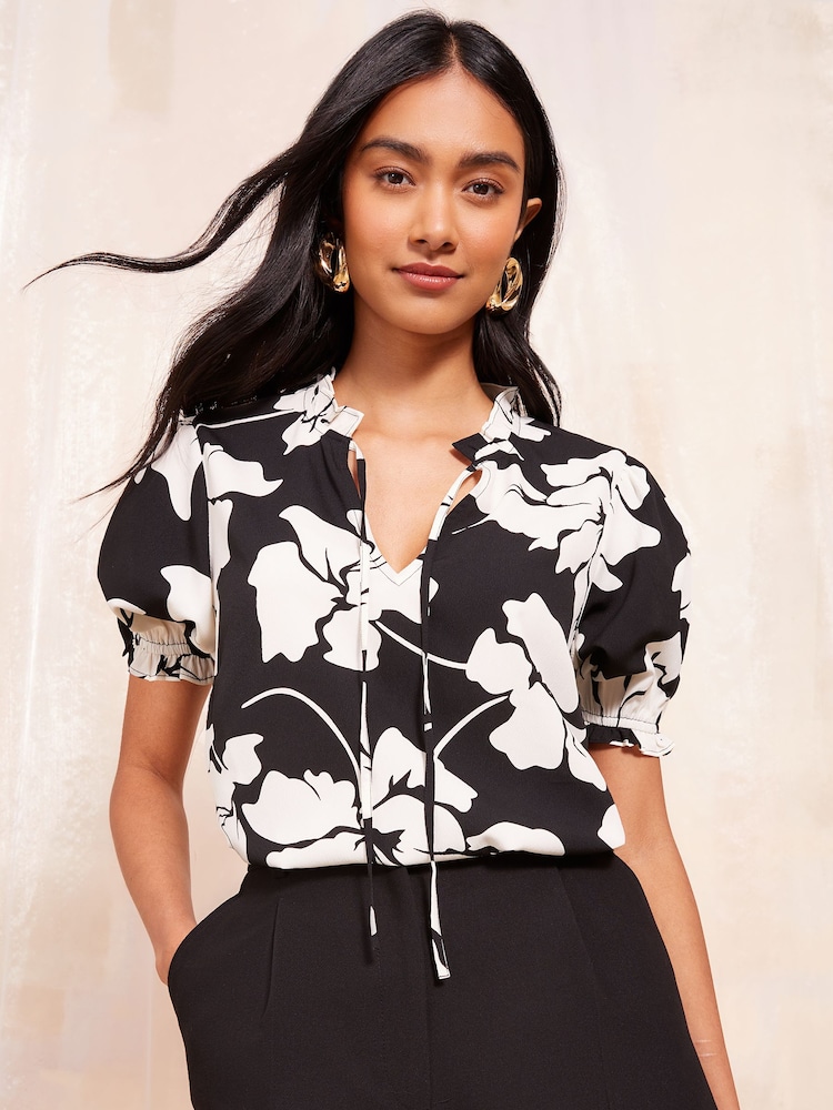 Friends Like These Black/White Short Sleeve Woven Tie Neck Blouse - Image 1 of 4