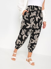 Yours Curve Black Leaf Print Shirred Harem Trousers - Image 1 of 5