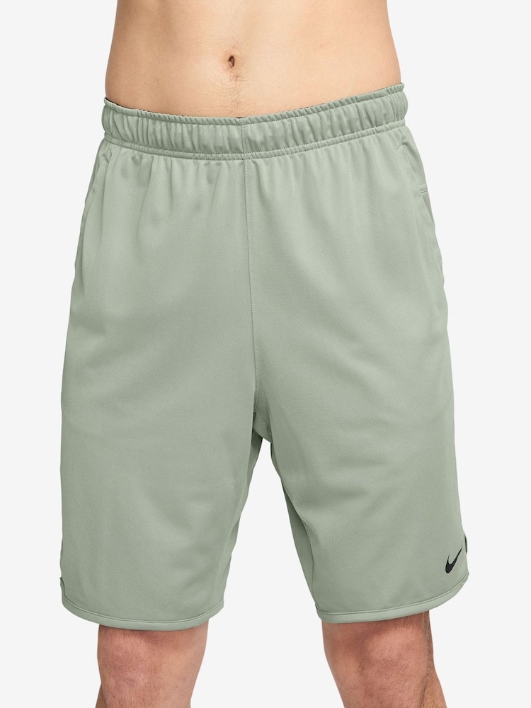 Зеленый - Nike Totality Dri-FIT 9 inch Unlined Versatile Shorts - Изображение 1 из 4