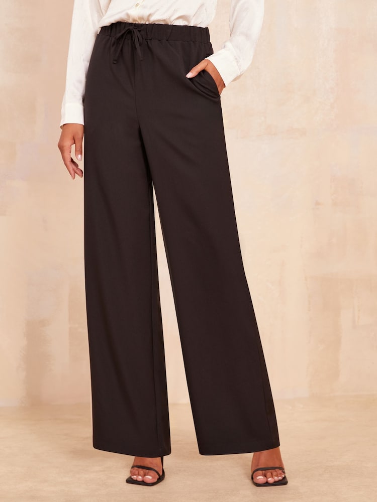 Friends Like These Black Wide Leg Elasticated Belted Trousers - Image 1 of 4 Friends Like These Black Wide Leg Elasticated Belted Trousers - Image 1 of 4