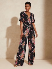 Love & Roses Black Floral Twist Front Jersey Jumpsuit - Image 1 of 4