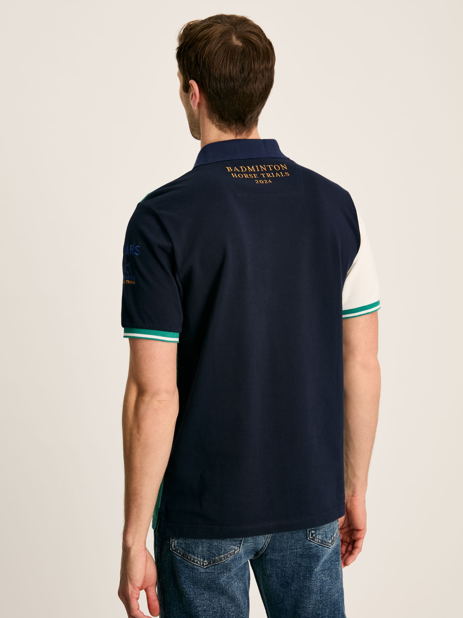 Buy Joules Official Badminton Green & Navy Polo Shirt from the