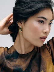 CERENE Luma Olive Green Gold Tone Statement Crystal Drop Earrings - Image 1 of 6