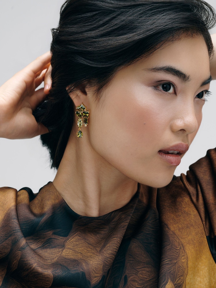 CERENE Luma Olive Green Gold Tone Statement Crystal Drop Earrings - Image 1 of 6 CERENE Luma Olive Green Gold Tone Statement Crystal Drop Earrings - Image 1 of 6