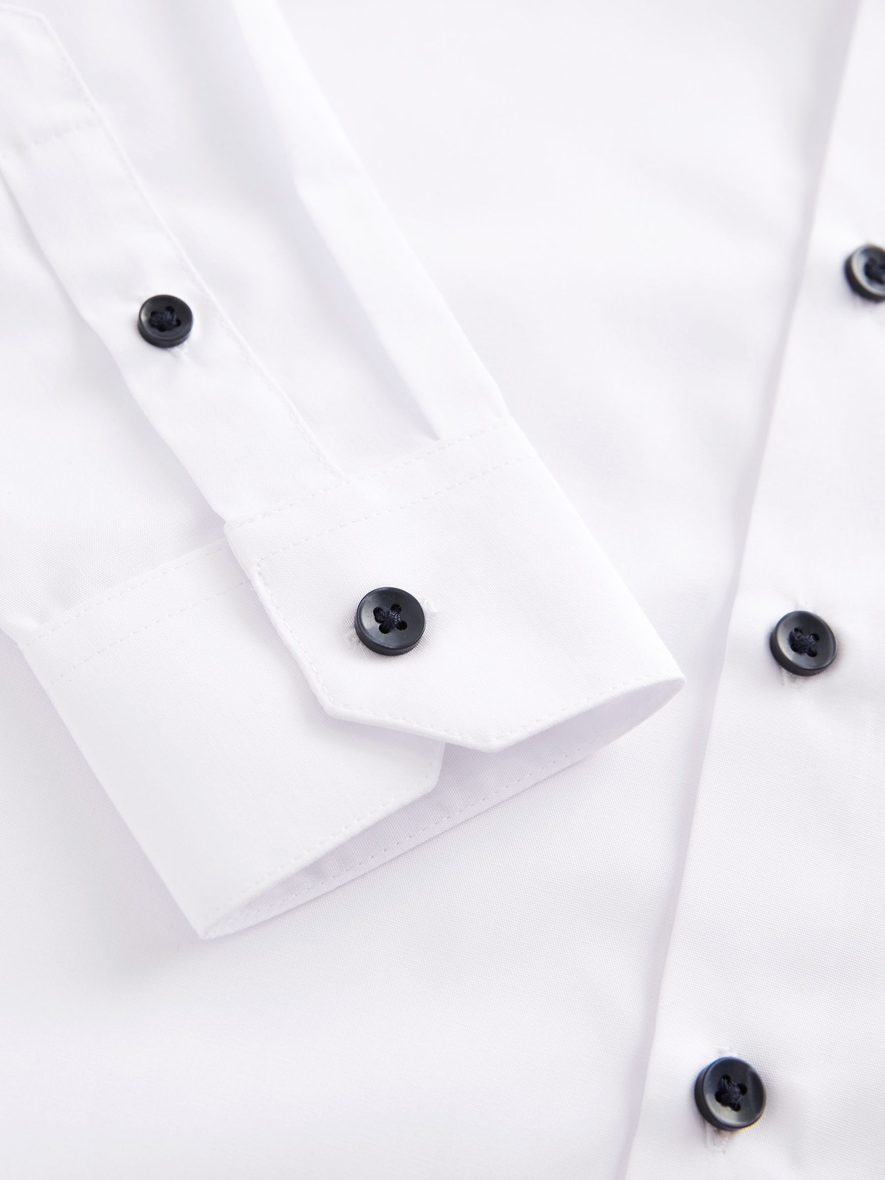 White dress shirt with black buttons on sale
