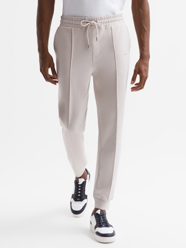 Reiss Off White Noah Interlock Drawstring Motif Joggers - Image 1 of 6 Reiss Off White Noah Interlock Drawstring Motif Joggers - Image 1 of 6
