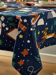 Catherine Lansfield Blue Santas Christmas Wonderland Wipeable 100% Cotton Table Cloth - Image 2 of 3
