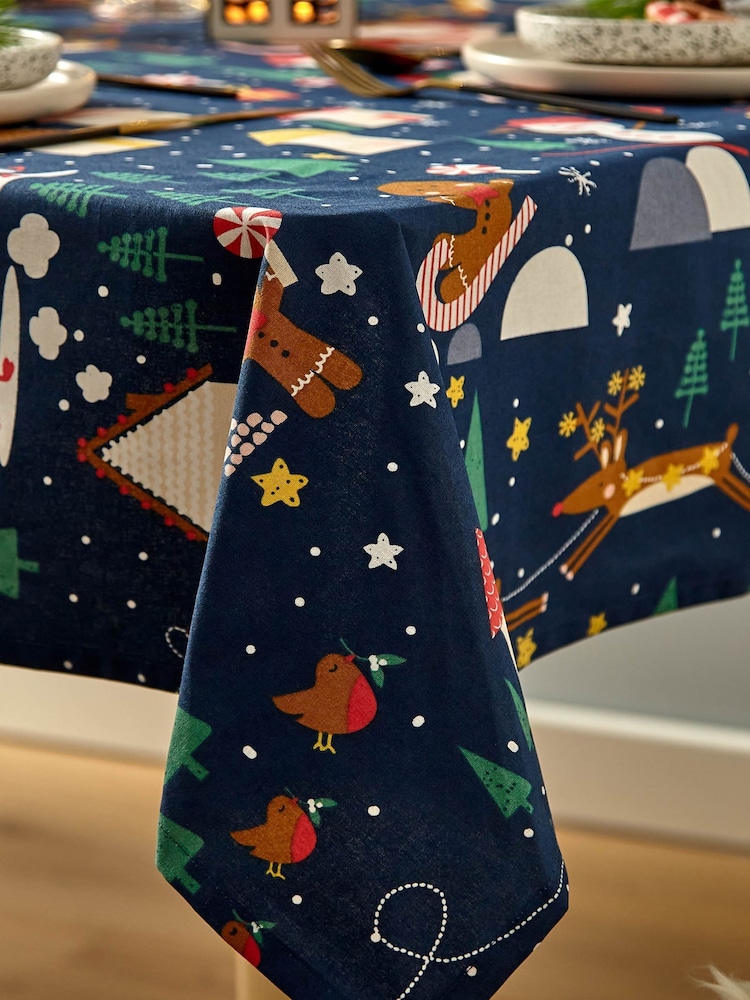 Catherine Lansfield Blue Santas Christmas Wonderland Wipeable 100% Cotton Table Cloth - Image 2 of 3