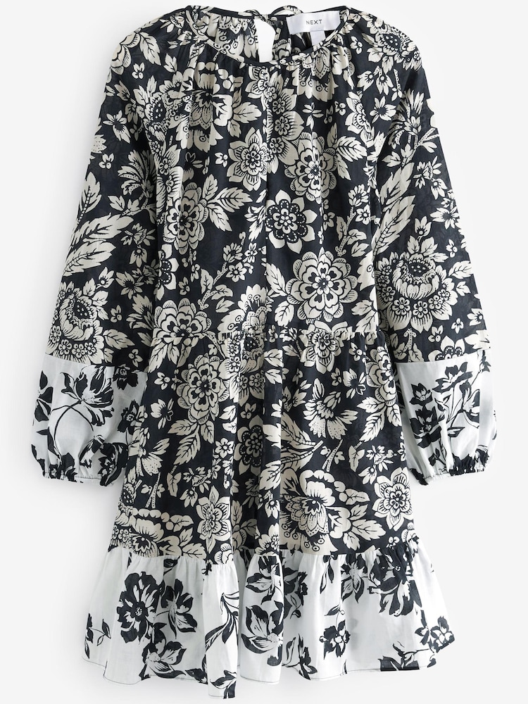 Schwarz/Weiß geblümt - Langärmeliges Mini-Sommerkleid aus 100 % Baumwolle - Bild 4 von 4 Schwarz/Weiß geblümt - Langärmeliges Mini-Sommerkleid aus 100 % Baumwolle - Bild 4 von 4