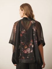 CERENE Jane Black Majestic Floral Print Sheer Cape Cover-Up With Satin Trim - Image 4 of 9