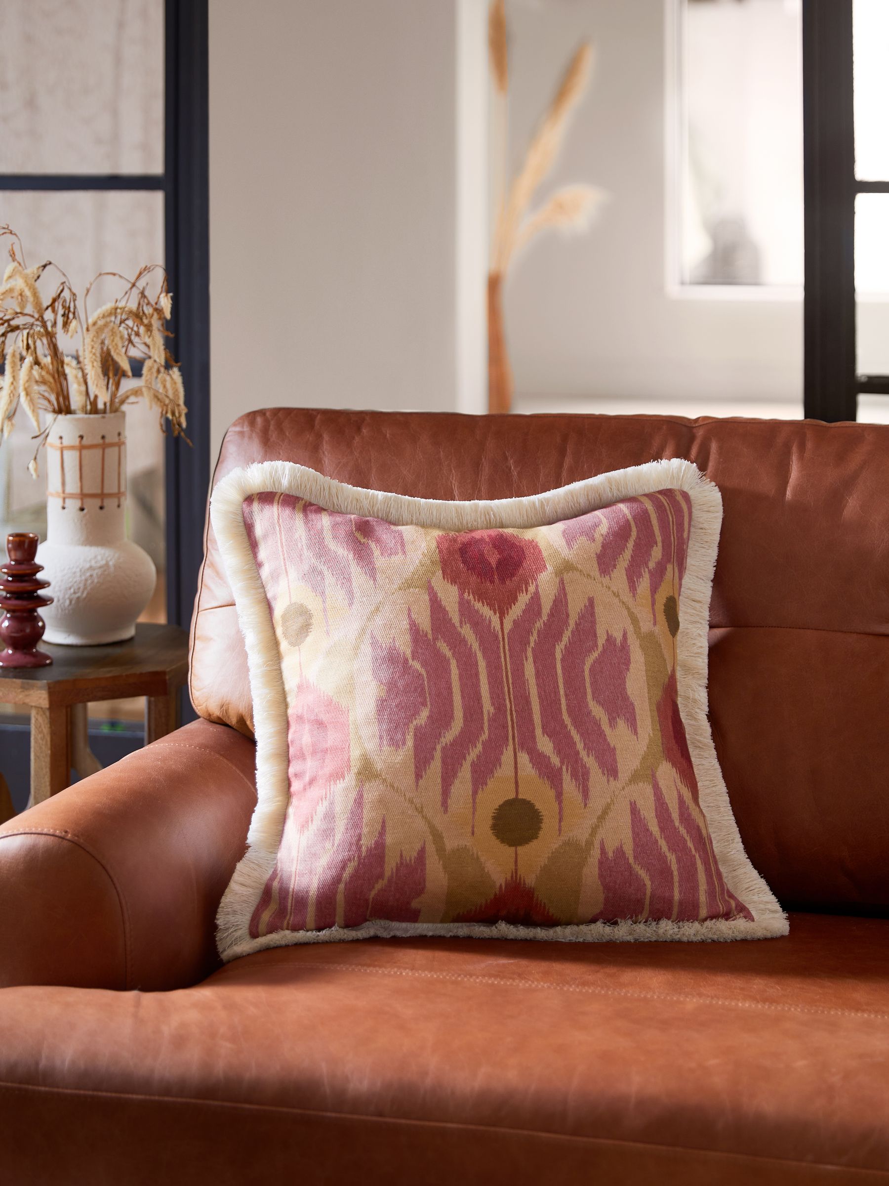 Buy Rose Pink 50 x 50cm Roaming Ikat Fringe Cushion from Next Luxembourg