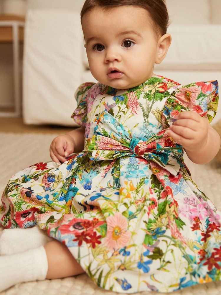 Multi Bright Floral Woven Bow Occasion Baby Dress (0mths-2yrs) - Image 1 of 5 Multi Bright Floral Woven Bow Occasion Baby Dress (0mths-2yrs) - Image 1 of 5