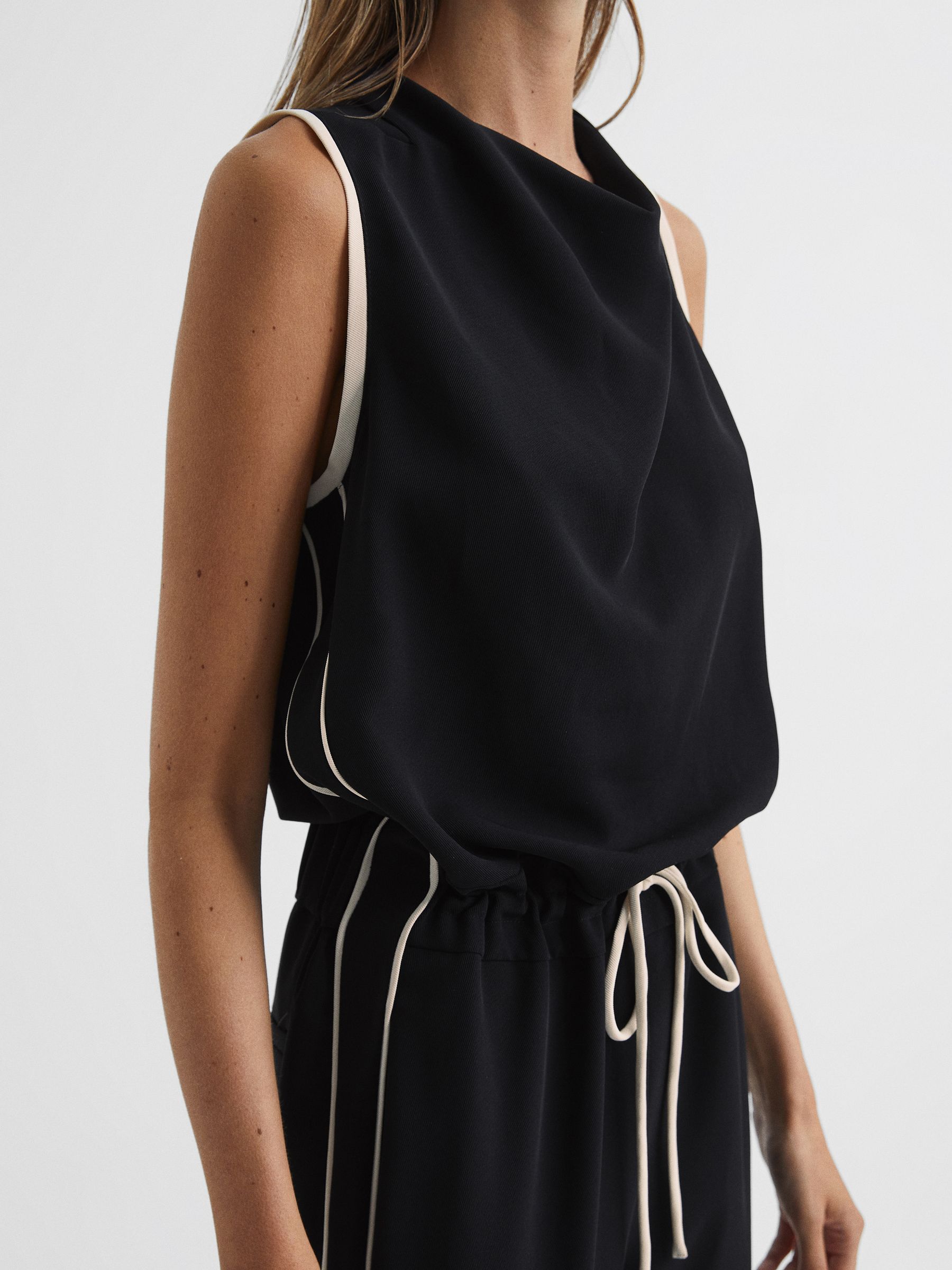 Black jumpsuit with white stripe on side deals