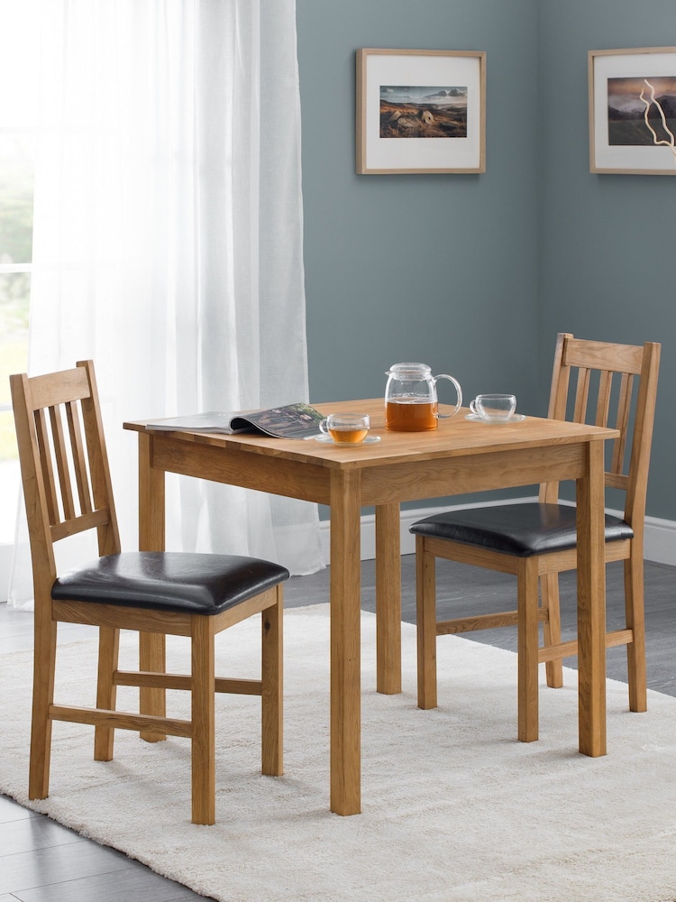 Julian Bowen Brown Coxmoor Solid Oak Compact 4 Seater Dining Table - Image 1 of 4