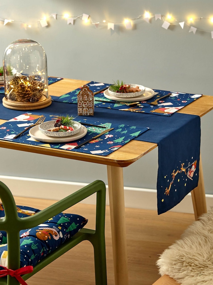 Catherine Lansfield Blue Santas Christmas Wonderland Wipeable 100% Cotton Table Runner - Image 2 of 3